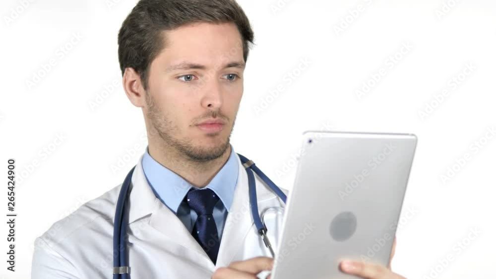 Young Doctor Using Tablet on White Background Young Doctor Using Tablet on White Background