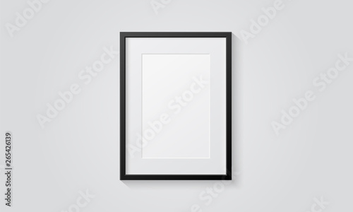 Picture frame isolated on a wall. Black and white color. Realistic modern template. A4 vertical format. Mock up for pictures or photo. Beautiful minimal clean design. Eps 10 vector illustration.