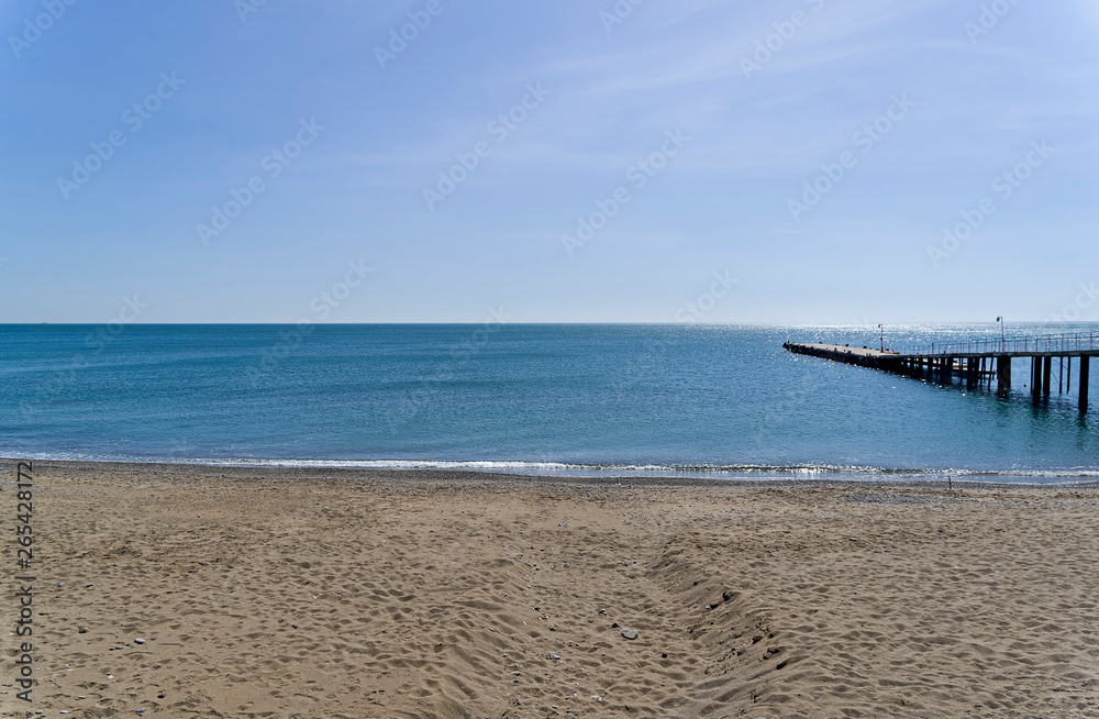 View of the sea horizon from an empty sandy beach. Crimea.