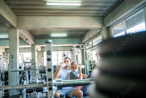Wallpaper Mural Couple of sport caucasian trainning together in fitness gym Torontodigital.ca