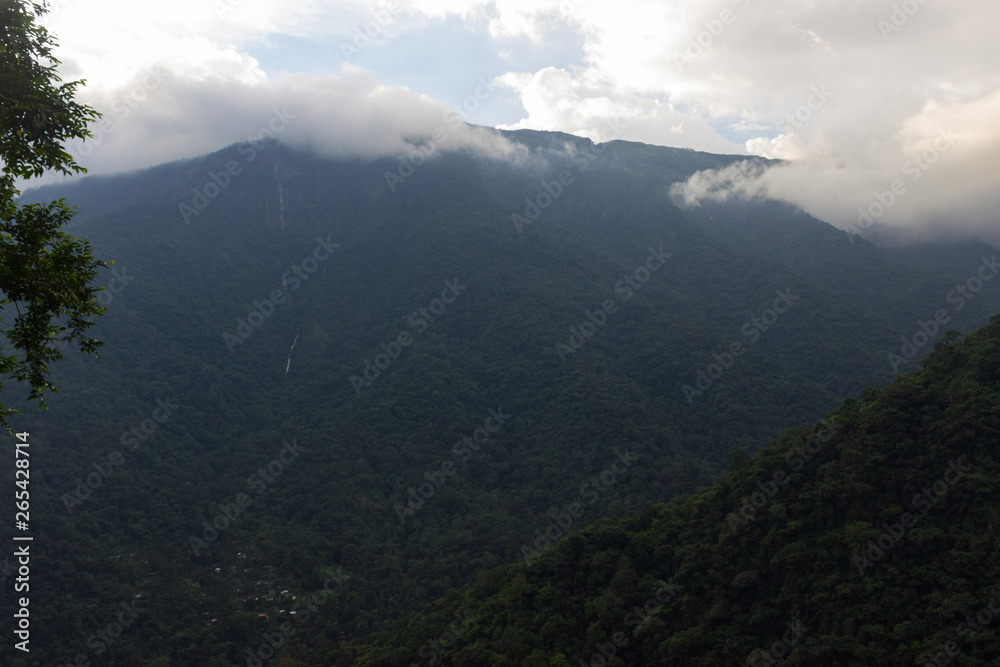 jungle mountains covered with clouds at dusk