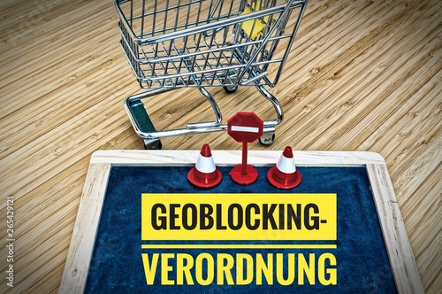 Einkaufswagen und Tafel mit Geoblocking Verordnung in englisch Geoblocking Regulation photo