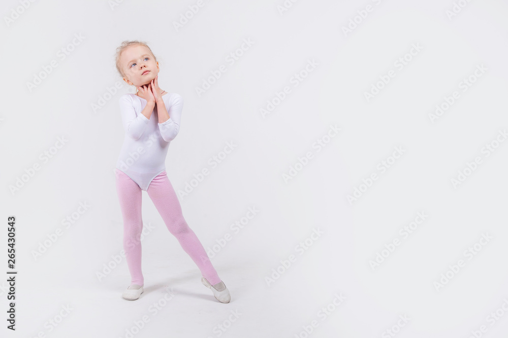 Happy little girl dancing isolated on white background