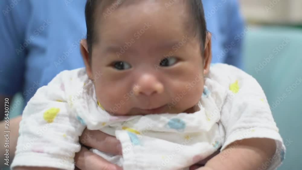 cute asian infant baby boy hungry cry in mom arm with love and careful cute asian infant baby boy hungry cry in mom arm with love and careful