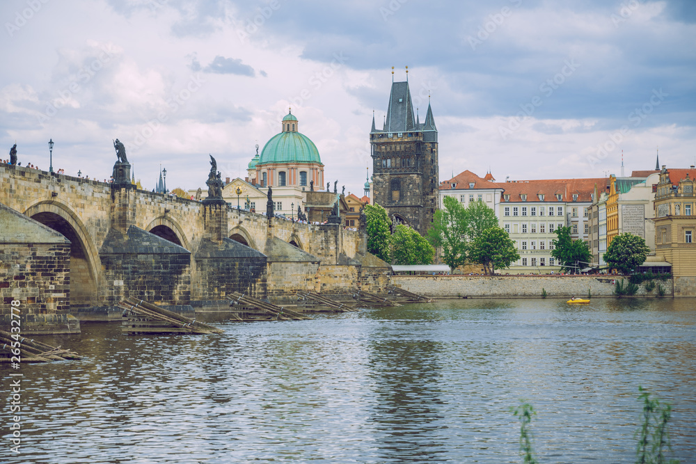 City Prague, Czech Republic. Tourists on the Charles bridge. Statues along the sides and river Vltava. Travel photo 2019. 25. April
