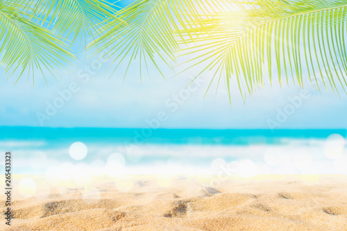 Fototapeta Naklejka Na Ścianę i Meble -  Tropical nature clean beach and white sand in summer with sun light blue sky and bokeh background.