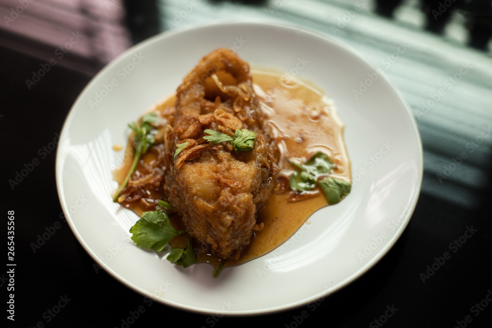 Fried Fish with Chilli on dish white.