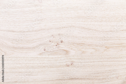 Light brown ash wood surface with natural pattern texture background.