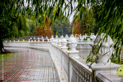 Embankment with a fence in the city park in Khmelnitsky, Ukraine_ photo