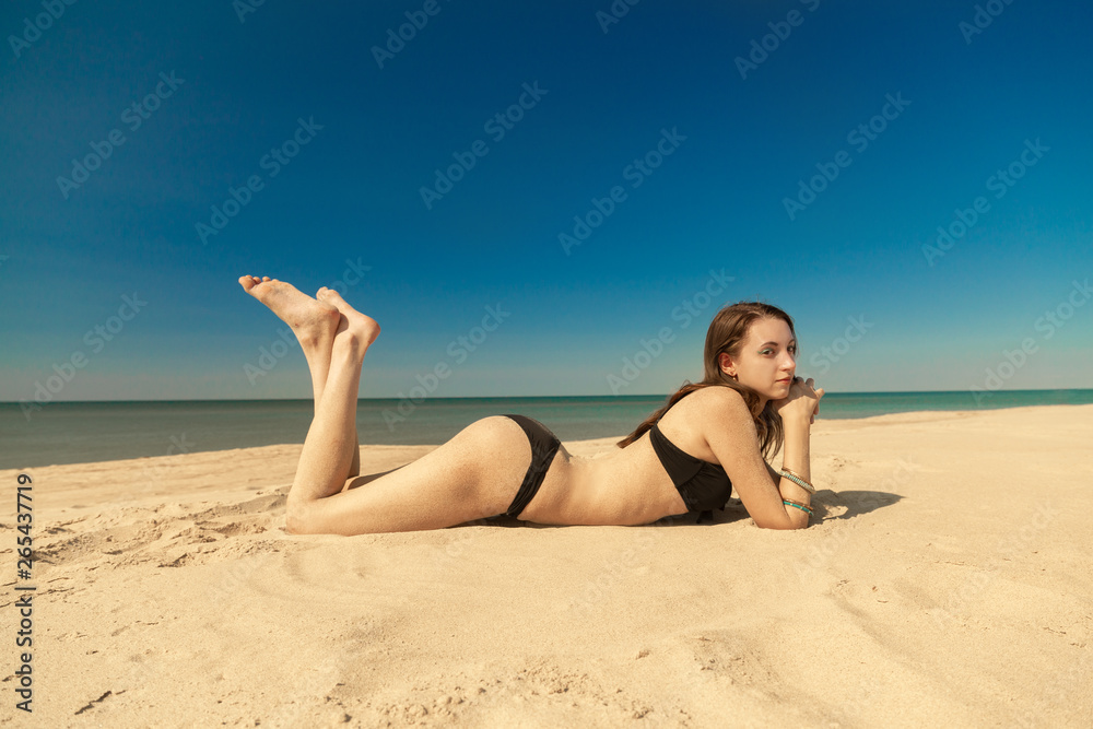 attractive woman tanning