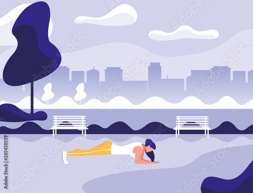 athletic woman doing push-ups in the park