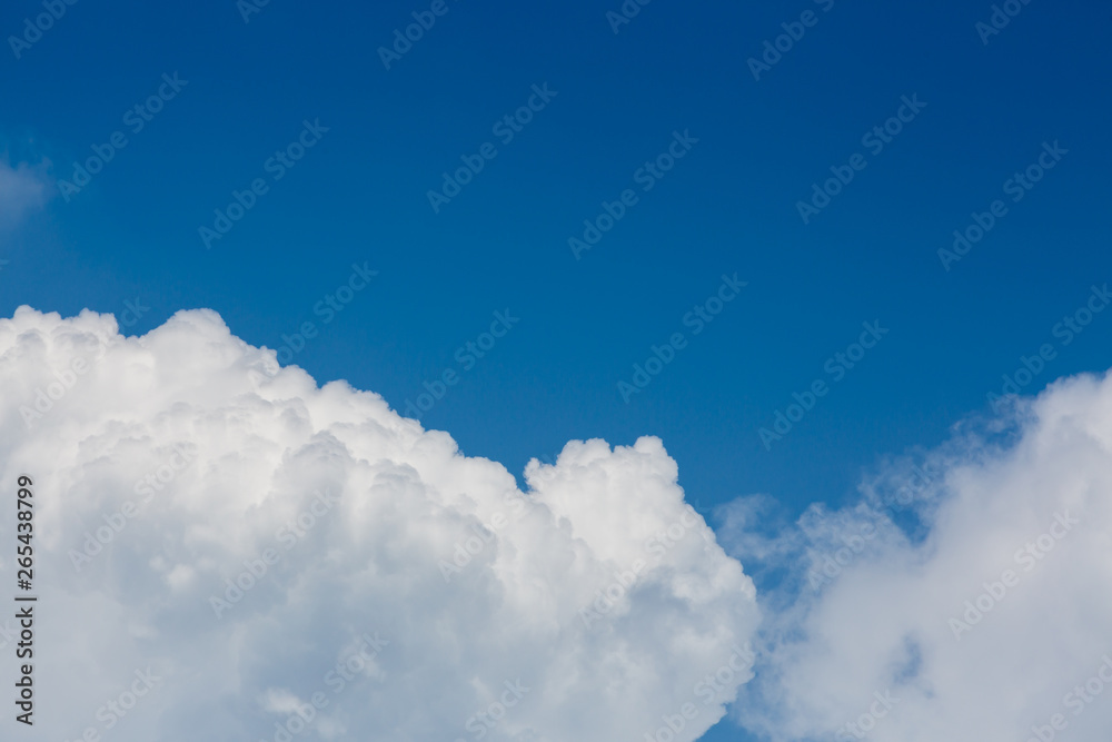fluffy white cloud above clear blue sky background