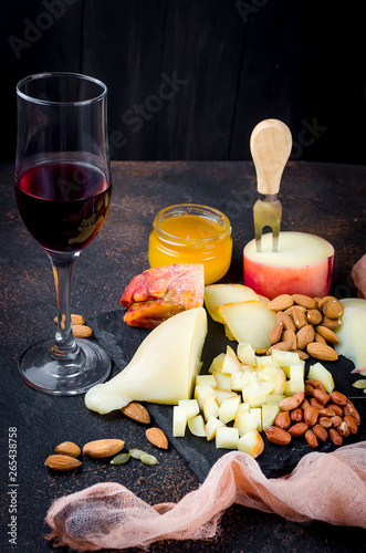 Assorted cheeses in various shapes and sizes photo