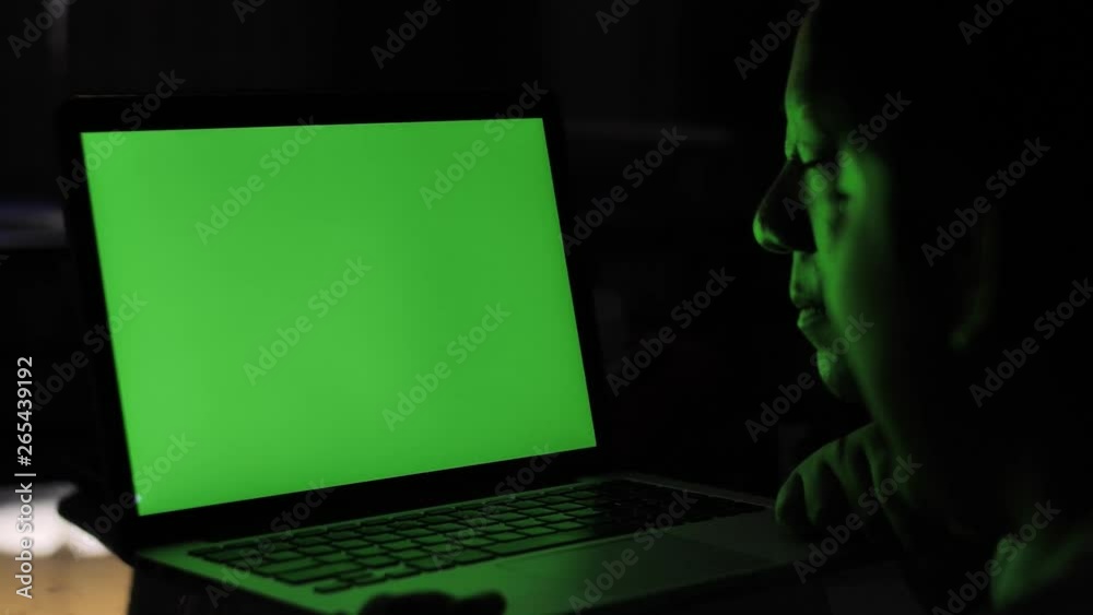 Mother and son looking on laptop green screen at home. Mother and son looking on laptop green screen at home.