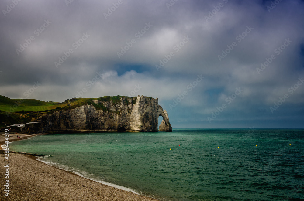 Etretat is best known for its white chalk cliffs, including natural arches. Normandy, France, Europe