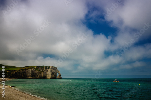 Etretat is best known for its white chalk cliffs, including natural arches. Normandy, France, Europe