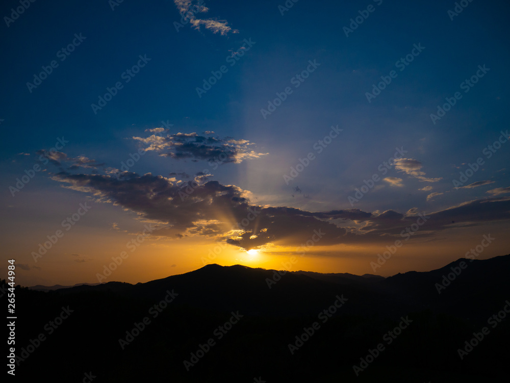 Obraz premium Beautiful landscape in the mountains at sunset. View of colorful sky with amazing clouds.