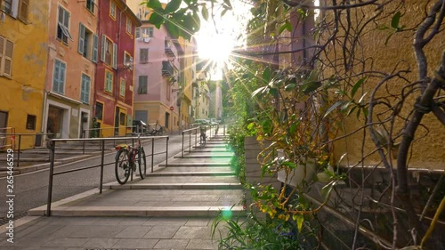 Nice, France. Gimbal sunrise shot of street with color houses in old town of Nice, France. 4K photo