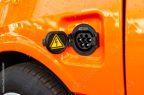 Close up image of the power socket of an electric car.