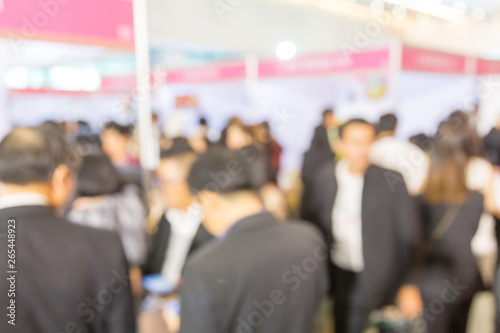 Blurred background of public exhibition hall. Business tradeshow, job fair, or stock market. Organization or company event, commercial trading, or shopping mall marketing advertisement concept