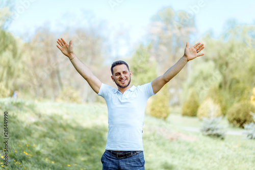 Happy man enjoying nature - freedom happiness concept.