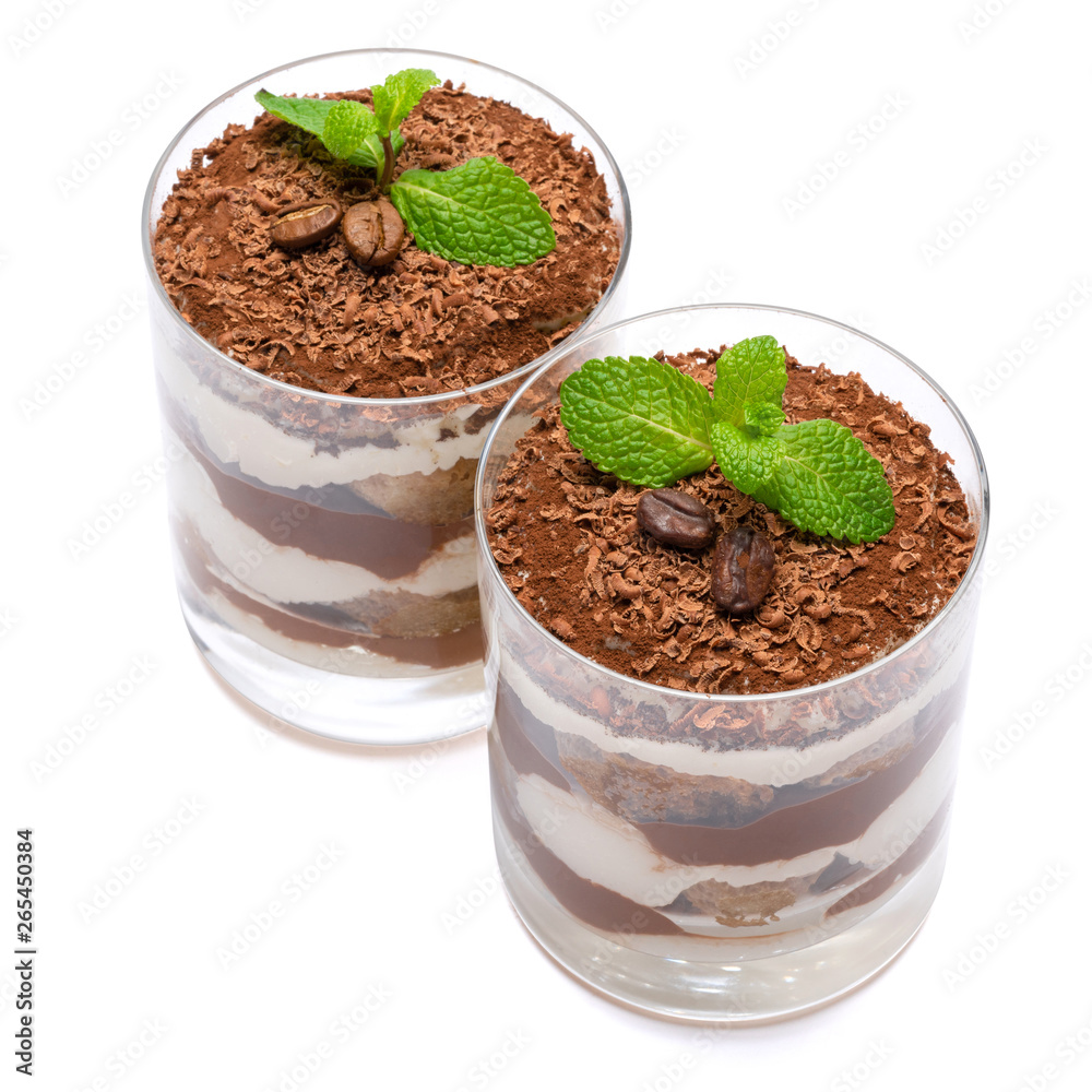 two portions Classic tiramisu dessert in a glass isolated on a white background two portions Classic tiramisu dessert in a glass isolated on a white background