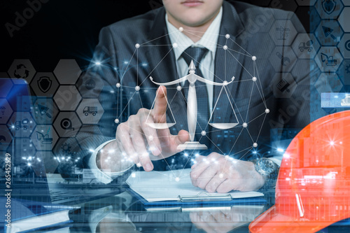 An engineer operating with juridical scales and financial system.