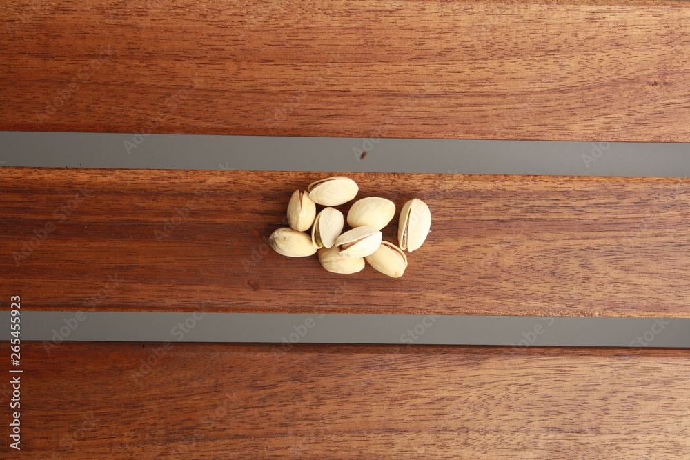 pistachios on wooden background