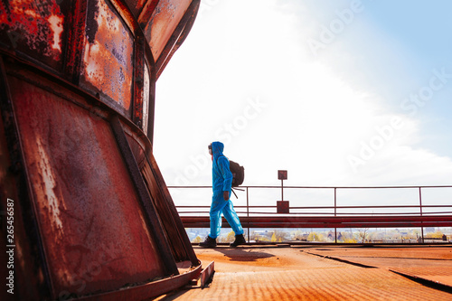 man environmental mask face pack disguise facemask bitmask protective overall blue sky orange rast plant factory disused catastrophe photo