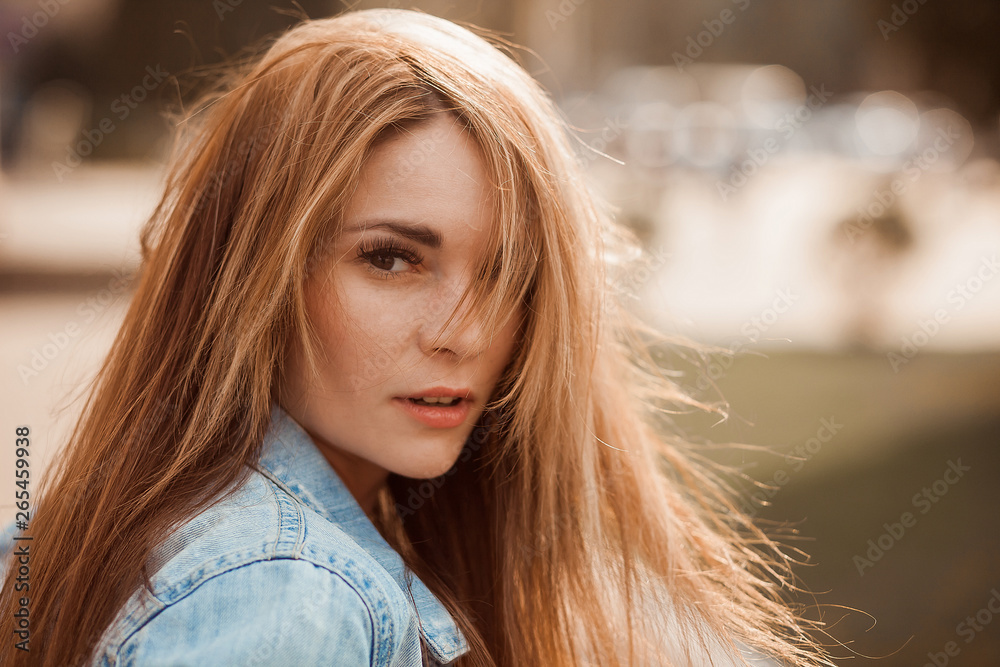 Portrait of a girl with long hair, looking at the camera. copy space Portrait of a girl with long hair, looking at the camera. copy space