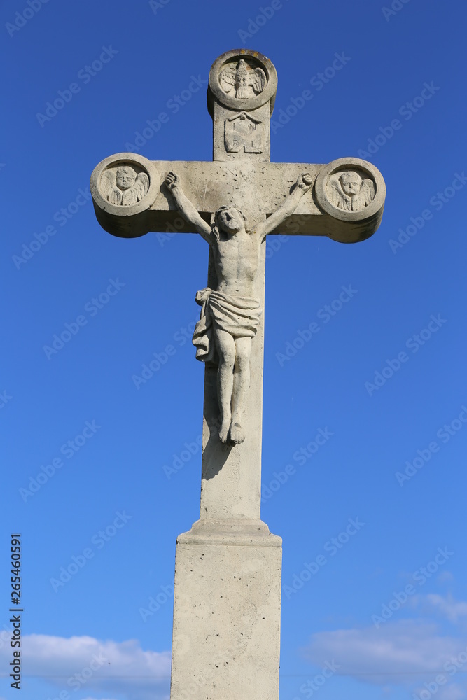 Jesus Christ on white stone cross sculpture