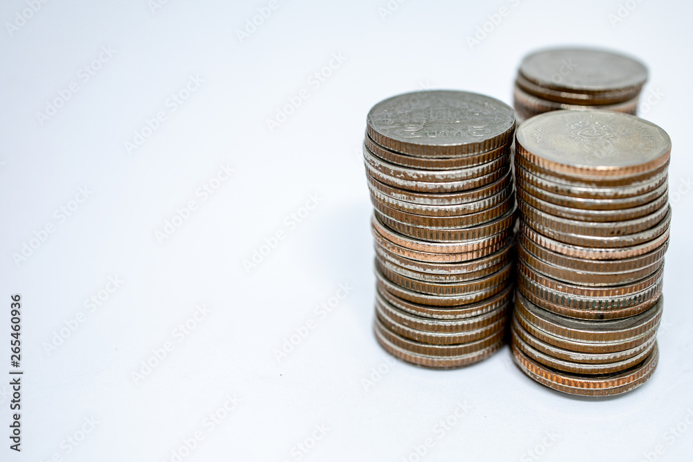 Currency in Thai baht with silver coins on white background. Abstract of saving money Currency in Thai baht with silver coins on white background. Abstract of saving money