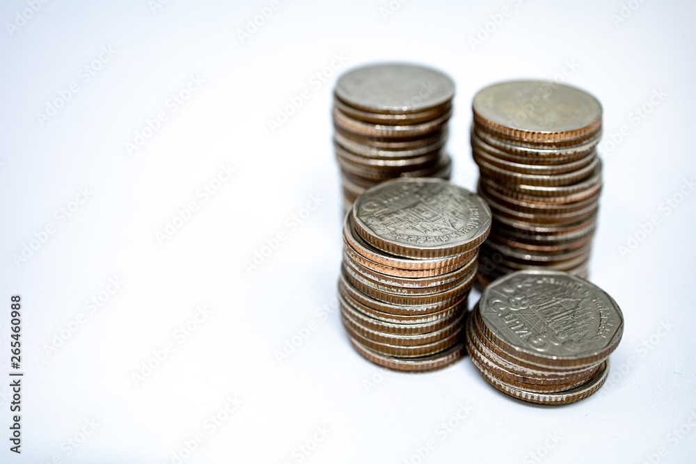 Currency in Thai baht with silver coins on white background. Abstract of saving money Currency in Thai baht with silver coins on white background. Abstract of saving money