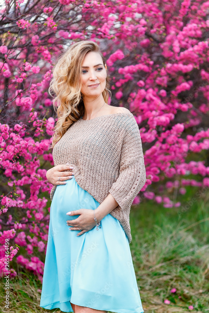 Happy pregnant asian woman walking at park. Happy pregnant asian woman walking at park.