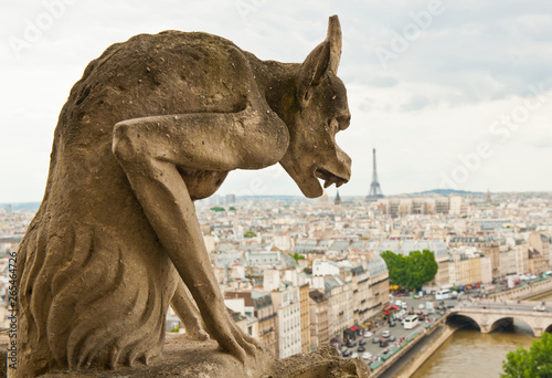 Chimera of Notre-Dame Cathedral. View of Paris and Eiffel Tower. France