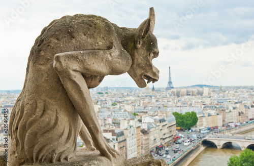 Notre-Dame Cathedral's Chimera and view of Paris with Eiffel Tower