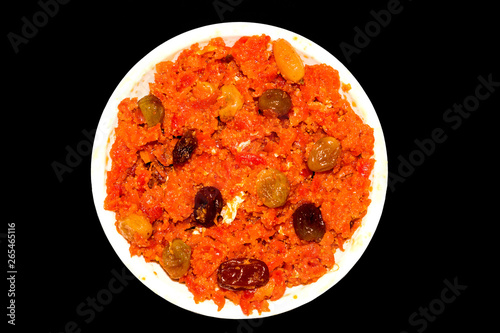 gajar halwa is carrot based pudding made with khya,milk,almond,pistachio. photo