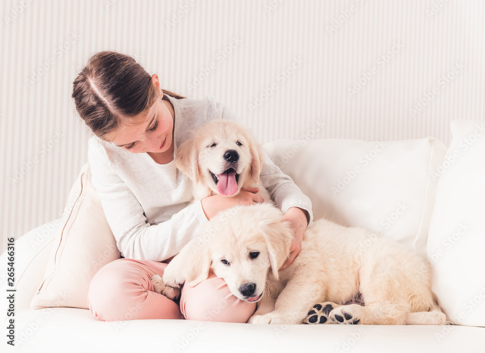 Smiling girl hugging puppies Smiling girl hugging puppies