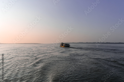 Sunrise over the Irrawaddy River seen from a Passanger Boat traveling from Mandalay to Bagan