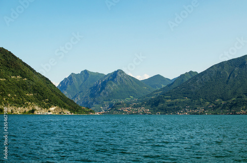 Panoramic view on Iseo lake with montains how background