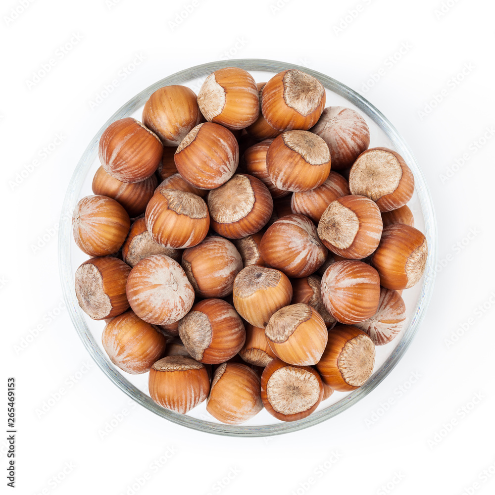 Filbert nuts in glass bowl isolated on white background with clipping path Filbert nuts in glass bowl isolated on white background with clipping path