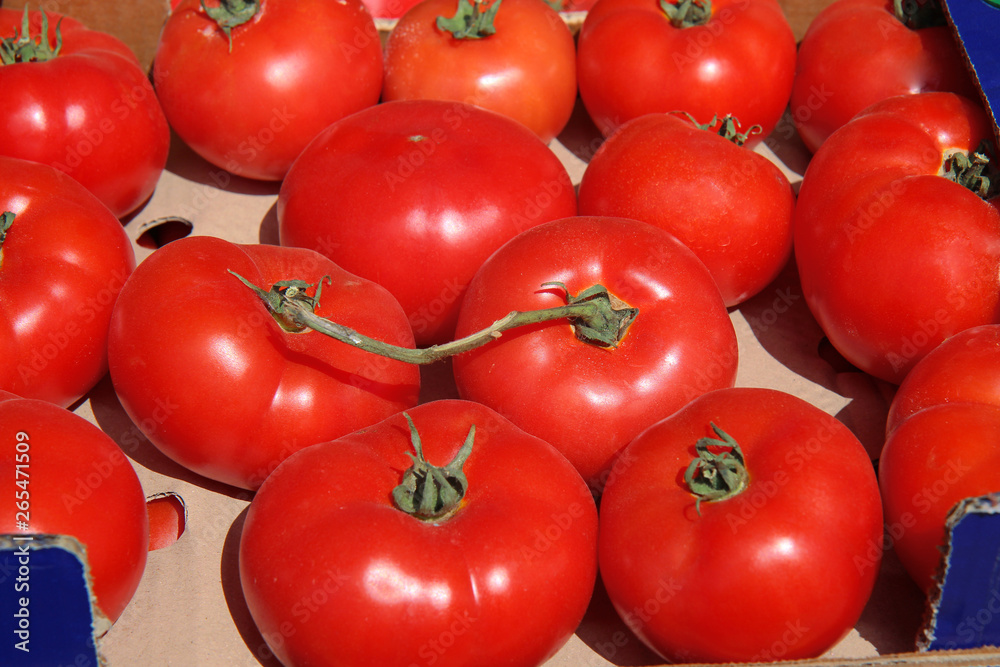 Background of many of juicy ripe red tomatoes Background of many of juicy ripe red tomatoes