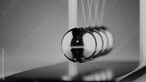 Camera moves around newton cradle. Physics concept.