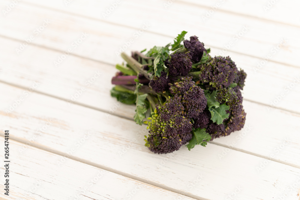 Purple Sprouting Broccoli on White Washed Wooden Background Purple Sprouting Broccoli on White Washed Wooden Background