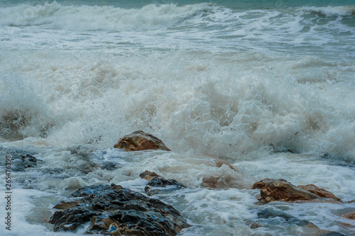 restless black sea, sea wave at the shore