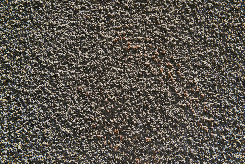 The texture of the concrete wall. A raw plaster wall background The texture of the concrete wall. A raw plaster wall background