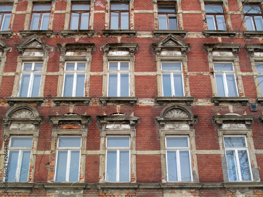 Old house facade non renovated with red bricks in germany
