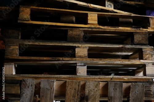 wooden pallets stack on black background