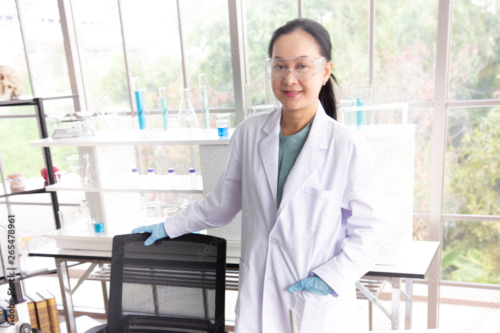 Asian woman scientist wearing glasses stand in laboratory room Asian woman scientist wearing glasses stand in laboratory room