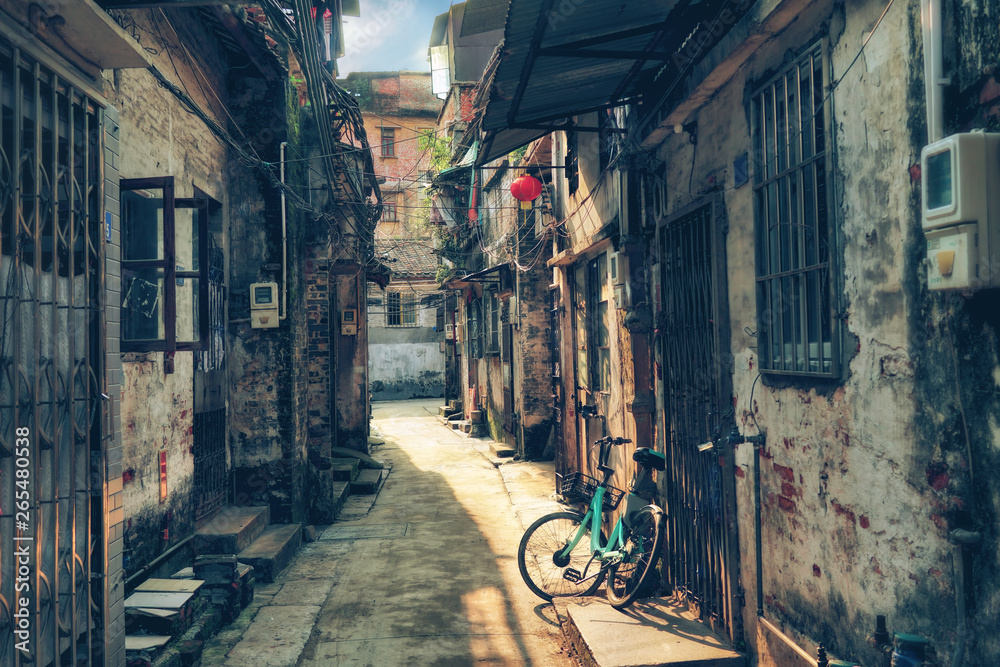 Around chinese hutongs in Guangzhou city, which are a type of narrow streets or alleys in typical neighborhoods with old houses.    